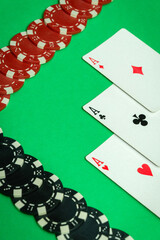Winning cards with a combination of three of a kind or set are neatly laid out on a green table in the club, and chips. The atmosphere is charged with the excitement of a good win in a poker game