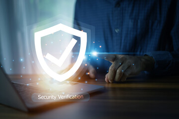 Businessman conducts a security verification process on his computer, safeguarding corporate...