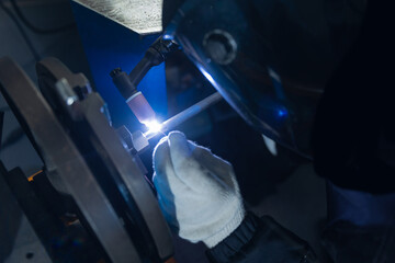 Welding process in protective argon environment in industrial factory