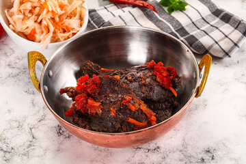 Baked beef cheeks with vegetables