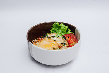 Egg rice bowl is a simple and nutritious food with a white background. 