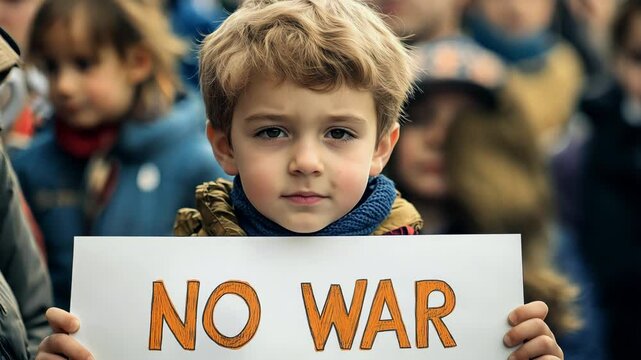 A child  boy stands firmly holding a sign that reads no war, advocating for peace among a gathering of supporters in the park