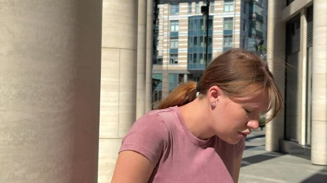 Young woman is suffering because of heat, hot weather, having sunstroke