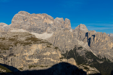 Dolomites rocky summits in the Alps. High tower peaks and sharp mountain rocky peaks of the Alps in the Dolomiti region, Italy. Beautiful scenic mountain range landscape in summer