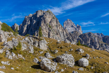 Dolomites rocky summits in the Alps. High tower peaks and sharp mountain rocky peaks of the Alps in the Dolomiti region, Italy. Beautiful scenic mountain range landscape in summer
