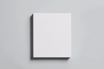 A minimalist white canvas placed against a light gray background, ideal for artistic expression and creativity.