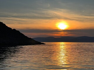 Sunset over the Adriatic Sea in the area at the foot of the Velebit mountain - Jablanac, Croatia (Zalazak sunca nad Jadranskim morem u podvelebitskom području - Jablanac, Hrvatska)