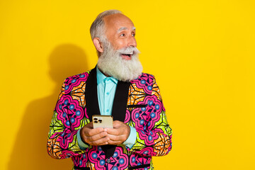 Photo portrait of nice senior male look empty space hold gadget wear trendy colorful fancy outfit...