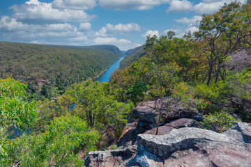 Photograph of the Nepean River under a cloudy blue sky from The Rock Lookout observation point in the Blue Mountains in New South Wales, Australia.