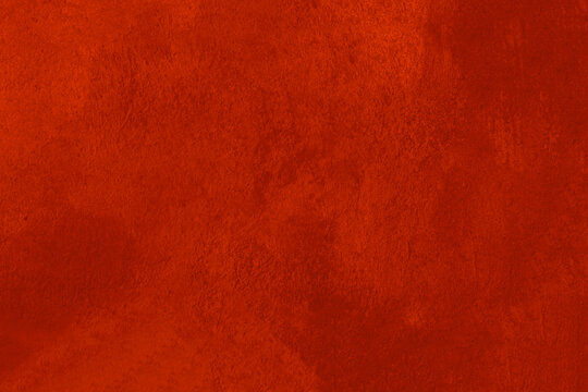 Texture of damaged, old red paint on the wall.