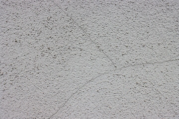 Gray concrete wall with a crack.