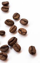 Minimalistic composition with coffee beans, elegantly arranged on a clean white background with scattered grains. Perfect for coffee-related projects, advertising, or branding.