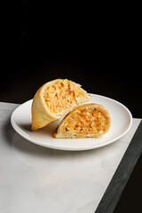 empanadas on a plate on a table in a restaurant