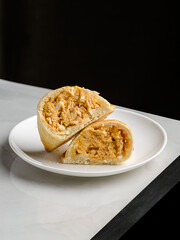 empanadas on a plate on a table in a restaurant