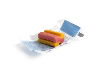 One retro chewing gum lies on a white background with a wrapper.