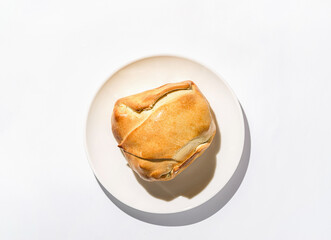 traditional Latin American empanadas on a white plate