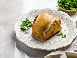 traditional Latin American empanadas on a white plate