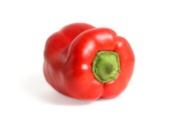 Red pepper lies on a white isolated background.	