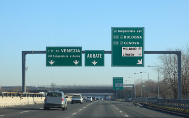 highway signs with directions to reach Italian cities or Milan LINATE airport in Northern Italy