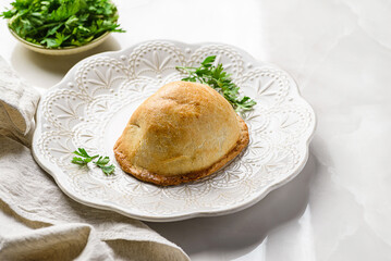 traditional Latin American empanadas on a white plate