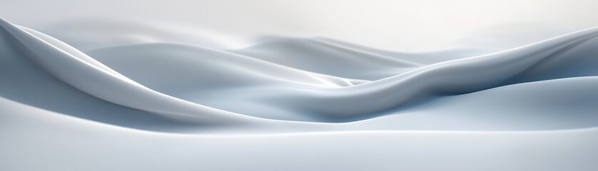 Obraz premium This abstract background showcases soft windblown snow, forming gentle ripples and smooth textures against a light gray backdrop. The calming atmosphere offers a modern aesthetic