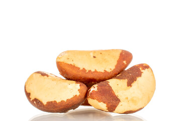 Brazil nuts without shells, macro, isolated on white background.