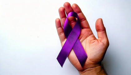photo of right hand with bright white background holding purple ribbon in hand. At the end of the ribbon is a circle to commemorate world cancer day