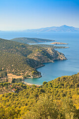 Scenic coastline with blue waters and lush green hills in Greece, Peloponnese