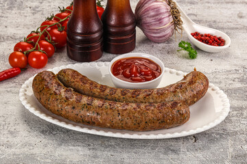 Grilled beef sausages with sauce