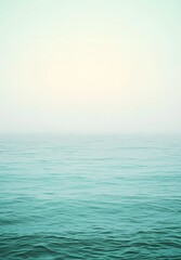 Obraz premium A tranquil oceanic gradient with soft teal, seafoam green, and pale aquamarine fading into subtle textures.