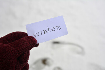 winter inscription on the background of a snowy park