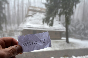 winter inscription on the background of a snowy park