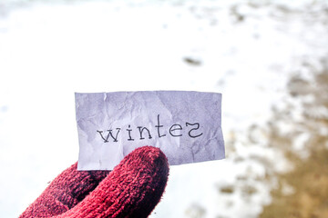winter inscription on the background of a snowy park