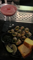 Snails with sauce and cocktail