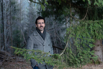 portrait of young man in the woods	