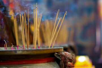 Incense sticks are a burner for worshipping and respect for ancestors and deities in shrines during the Chinese New Year.