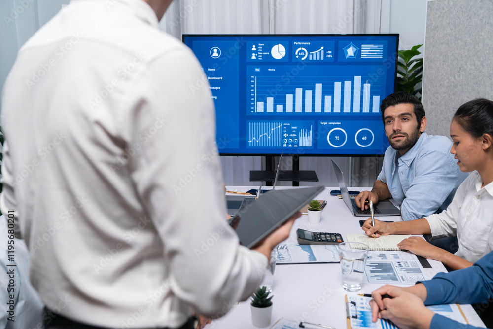 Fototapete analyst team utilizing bi fintech to analyze financial data at table in meeting room. businesspeople
