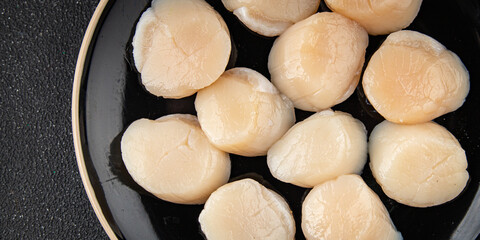 Raw sea scallop seafood fresh tasty food dish gourmet food background on the table rustic food top view copy space keto and paleo diet vegetarian  food pescetarian diet