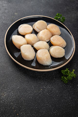 Raw sea scallop seafood fresh tasty food dish gourmet food background on the table rustic food top view copy space keto and paleo diet vegetarian  food pescetarian diet