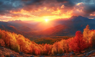 Fototapeta premium A panoramic view capturing the sunset over a mountain range in autumn