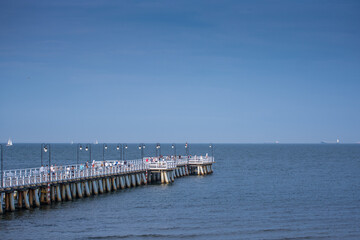 White pier in blue water