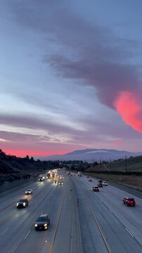 Freeway sunset with a pink sunset over the Inland Empire, California video.