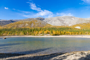 Scenic view of Khibiny mountains with North Chorrgor pass with small lake on foreground. Kola...