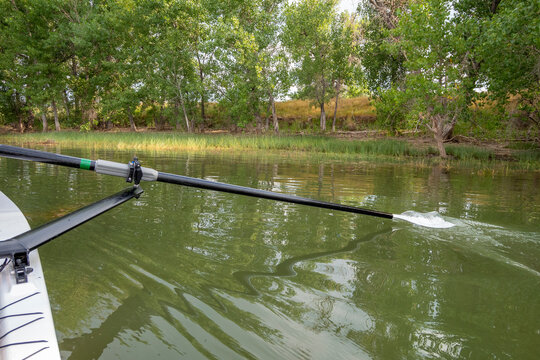 hatchet sculling oar on a calm lake, Boyd Lake in Colorado