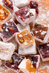 Sweet food Turkish delight, assorted rahat locum in form of cubes with nuts and powdered sugar, traditional food