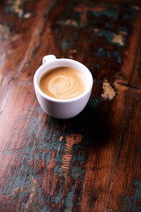 Cup of coffee on wooden background. Soft focus. Copy space.