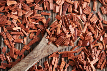 Red sandalwood chips on a spoon