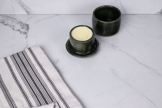 French butter crock on a white countertop 