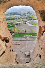 A rock with niches in which Buddha statues once stood in Bamian, Afghanistan