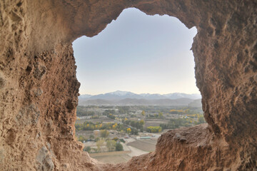 A rock with niches in which Buddha statues once stood in Bamian, Afghanistan